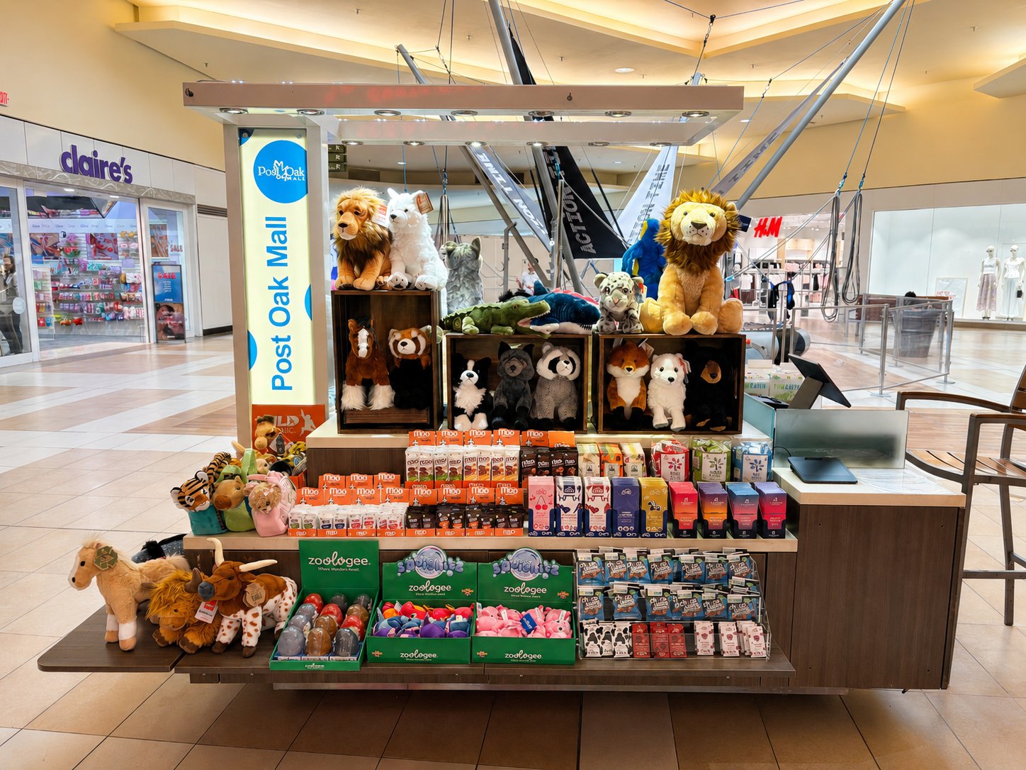 Cuddle Candy Co kiosk display with premium chocolates and plush toys at Post Oak Mall