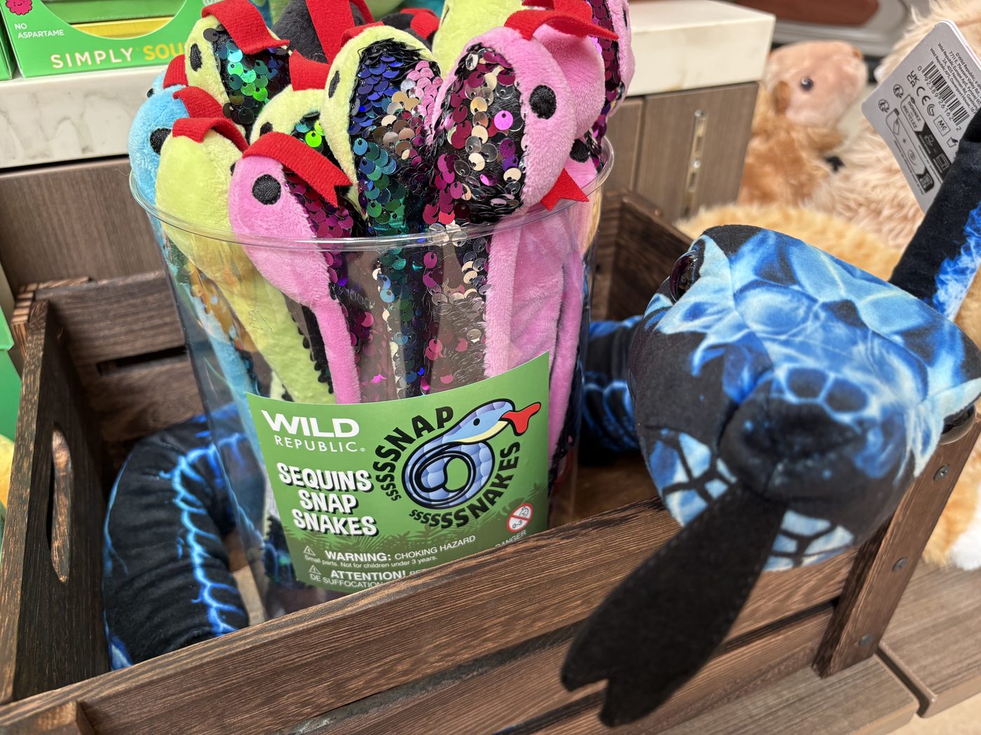 Wild Republic Sequins Snap Snakes with blue plush turtle at the Cuddle Candy Co kiosk